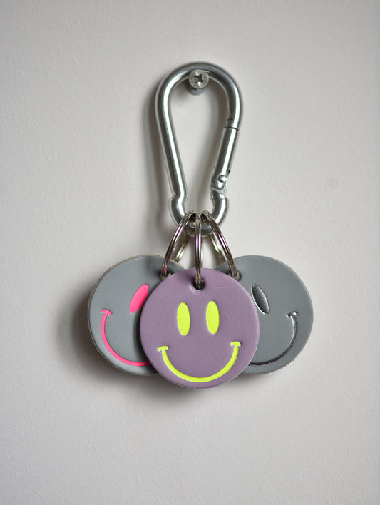 SMILEY SILVER ON GREY LEATHER KEYRING