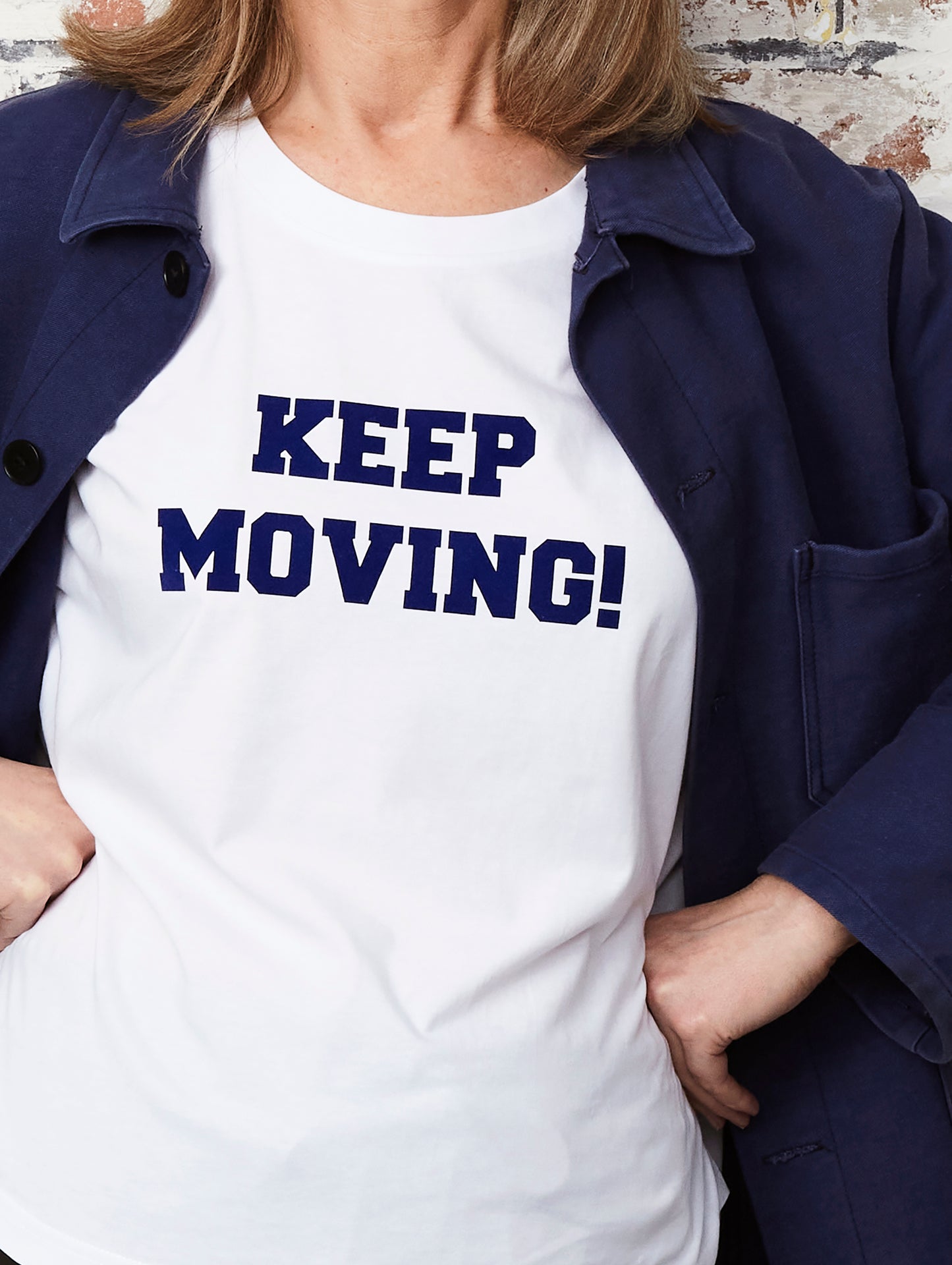 Keep moving in navy flock on a white organic cotton relaxed fit t-shirt
