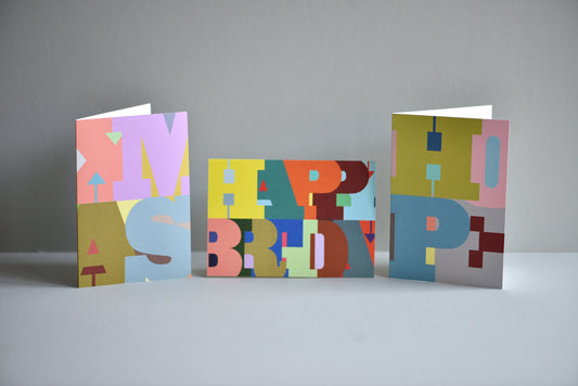 Three colorful birthday cards with 'Happy Birthday' text on a gray background