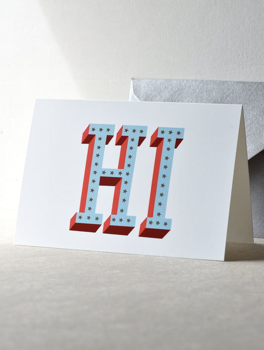 Greeting card with 'HI' in red and blue on a white background