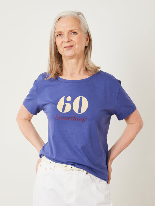 Woman wearing a blue t-shirt with '60 Something' text on a plain background