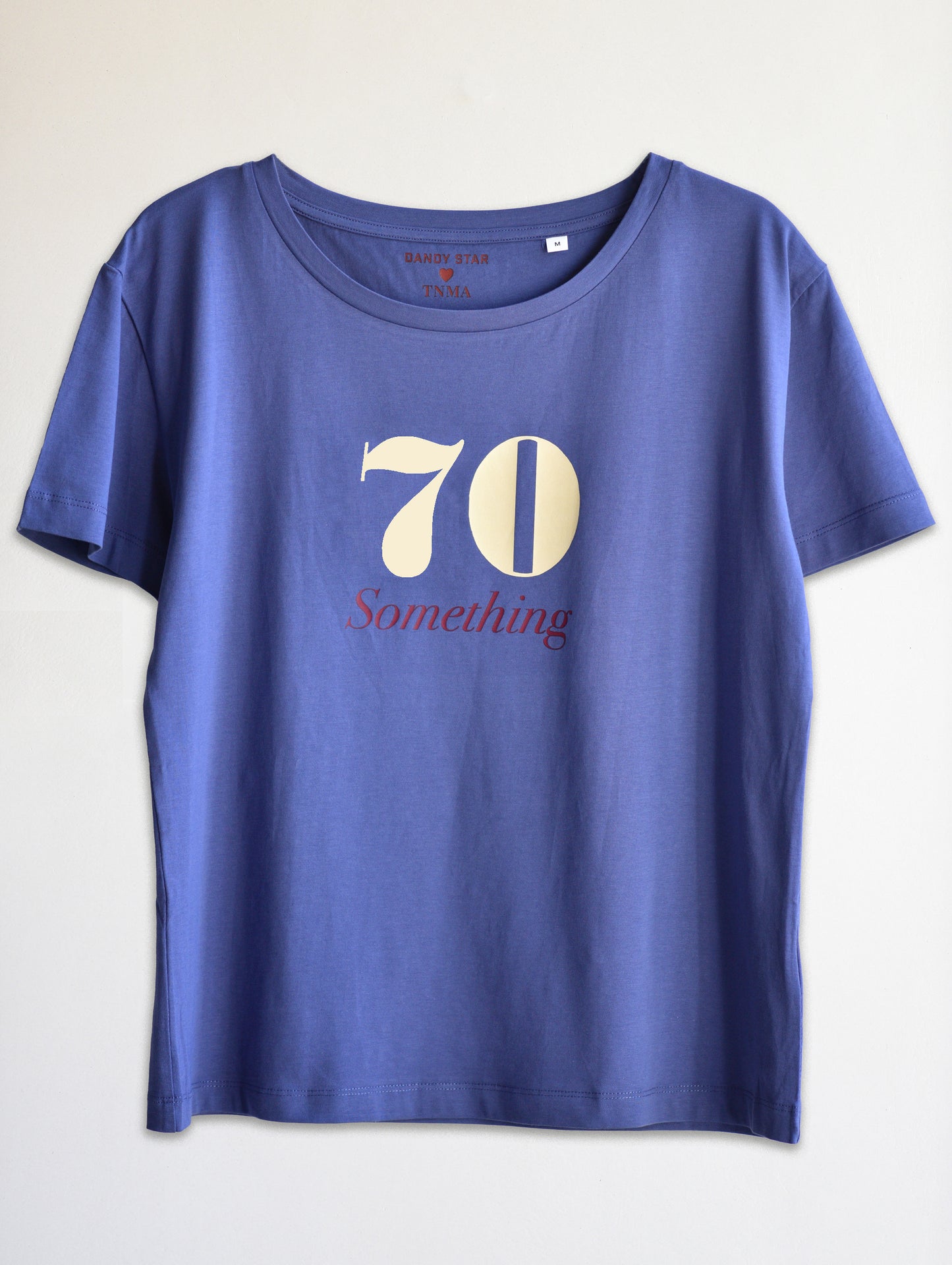 Blue t-shirt with '70 Something' design on a white background
