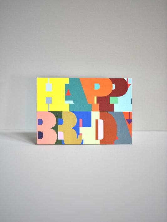 Colorful 'Happy Birthday' card on a gray background