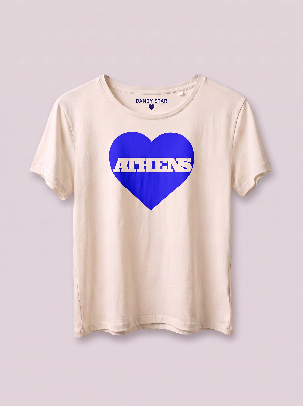 A cream-colored short-sleeve t-shirt with a blue heart graphic on the front containing the word 'ATHENS' in white. The brand name 'SANDY STAR' is printed inside the collar.