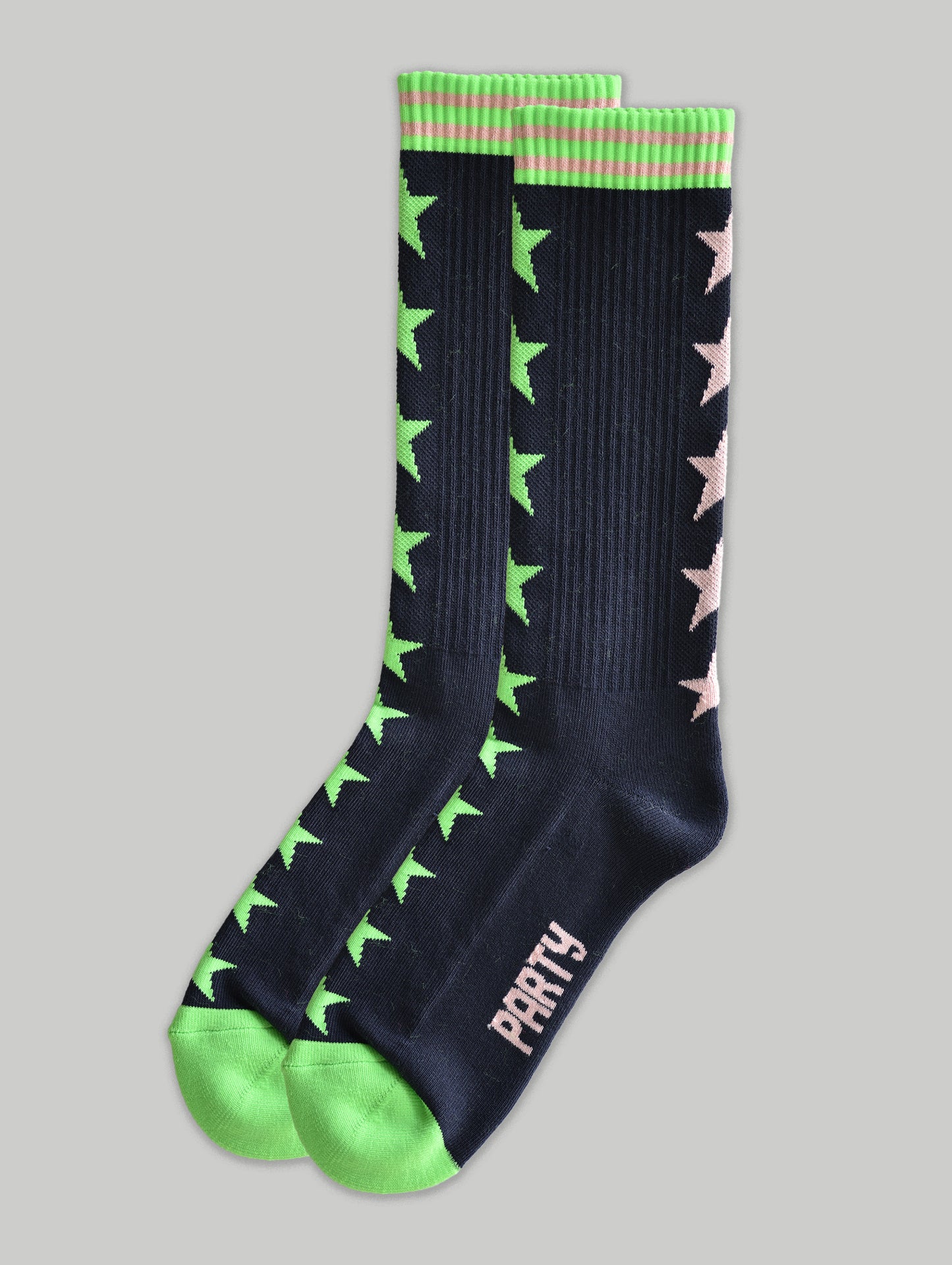 Black socks with green and pink star patterns on a gray background