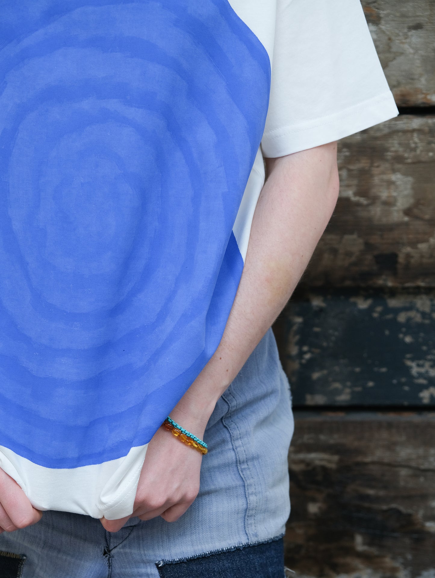 Hand painted blue moon t-shirt on off white organic cotton close up