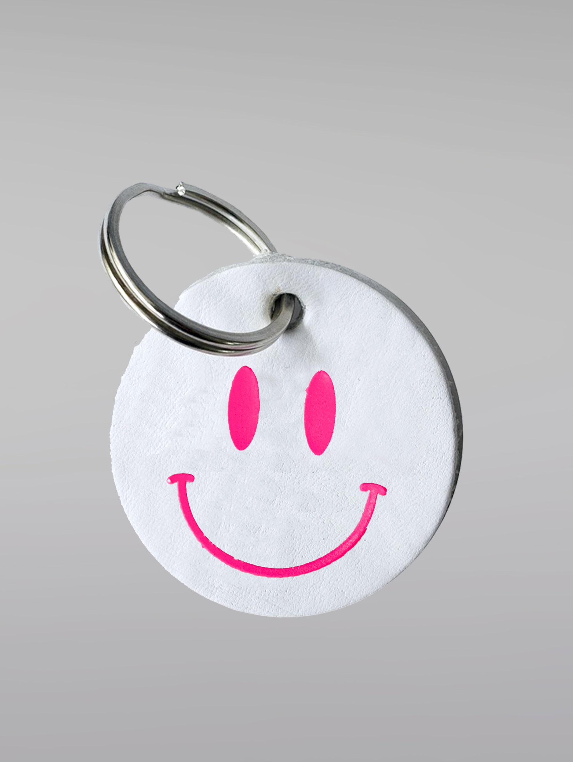 White smiley keyring