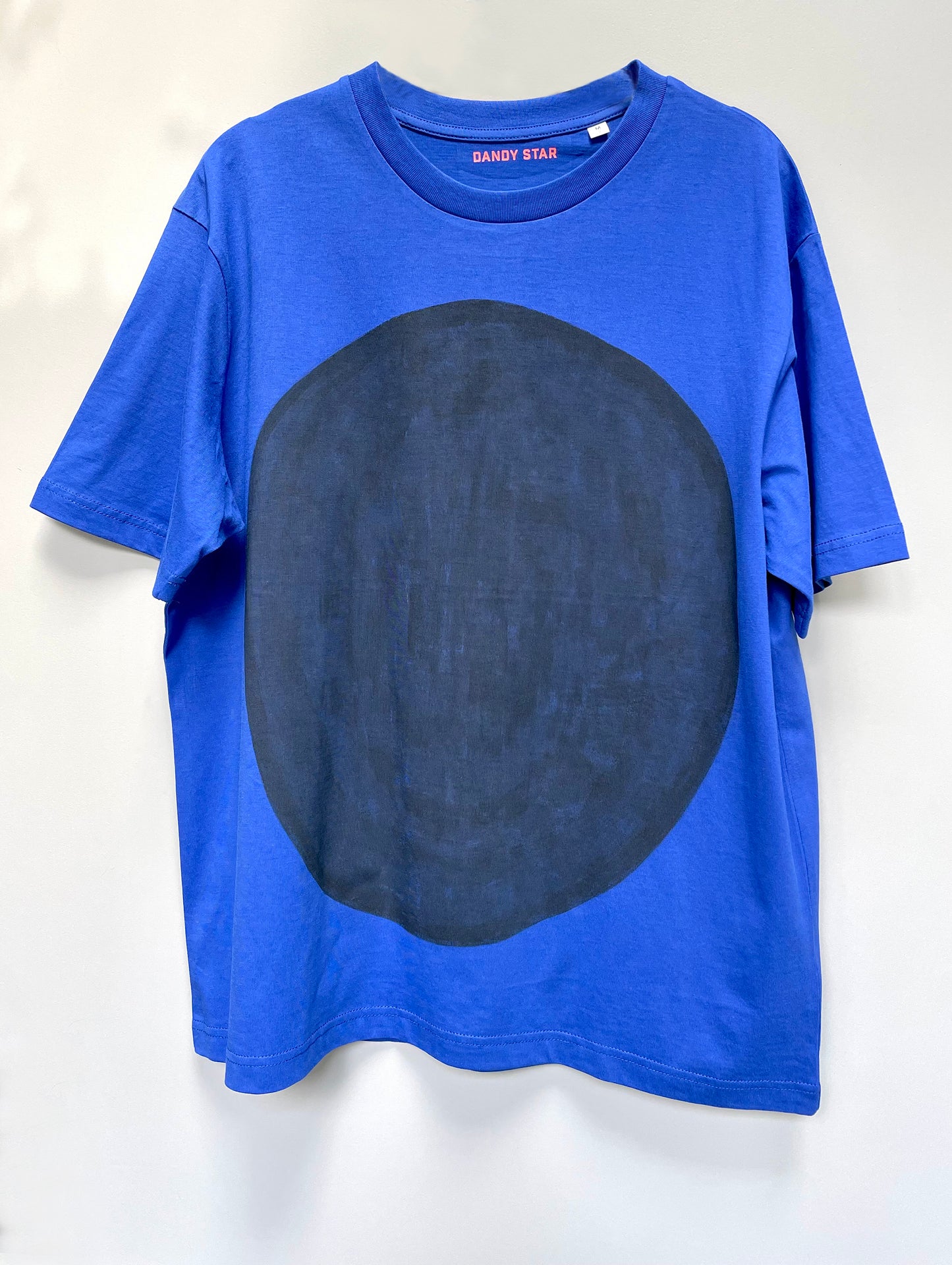 hand painted black dot t-shirt on worker blue organic cotton
